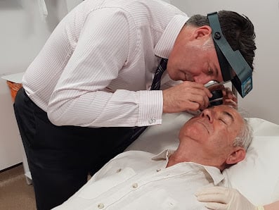 Clinician examining a patient's skin at The London Skin and Hair Clinic